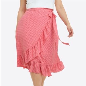 Draper James seersucker A-line wrap skirt in playful pink gingham with ruffles.